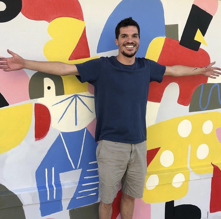 Max Goldin with his mural