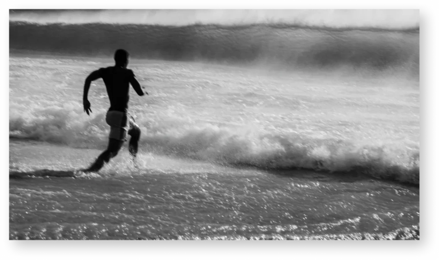 Man running into the sea